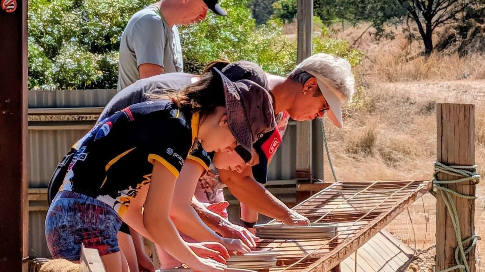 Visitors enjoying a fossicking experience